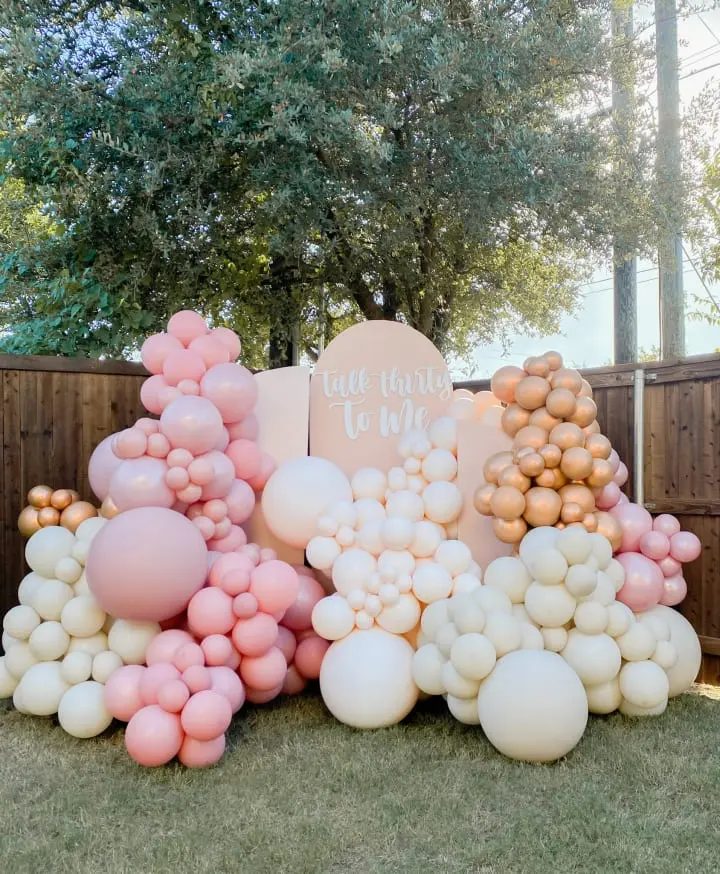 a bunch of balloons that are on the ground in front of a sign that says it's time to be married